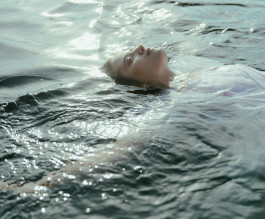 Woman's face emerging from the water