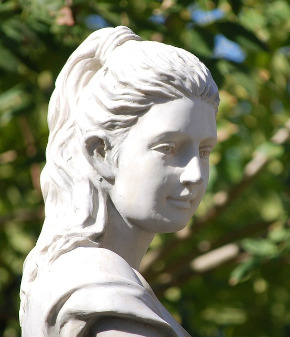 Bust sculpture of a Goddess with tied hair, rendered in classical style